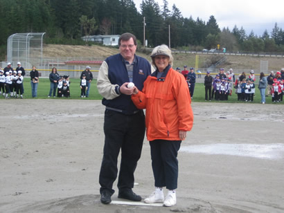Commissioners Lynda Ring Erickson and Ross Gallagher preparing to throw out the ceremonial first pitch at the Sandhill Park Dedication on 4/14/07